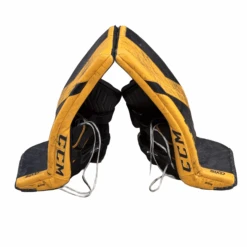 CCM AXIS - Used Pro Stock Goalie Pad Set (Black/Yellow) -Hockey Stick Market Image 20250317 164454 700 transparent Craiyon