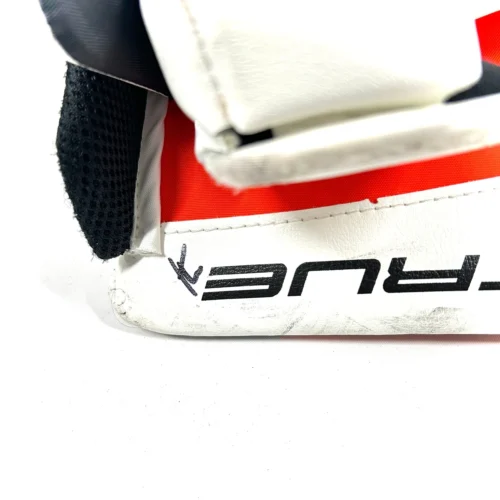True L20.2 - Used Pro Stock Goalie Blocker (White/Black/Orange) 7 True L20.2 - Used Pro Stock Goalie Blocker (White/Black/Orange) -Hockey Stick Market Photo2023 11 16 30922PM scaled